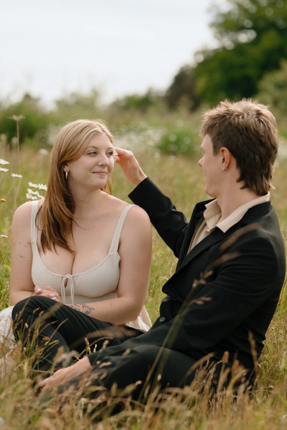 Claire and Evan in a wildflower field